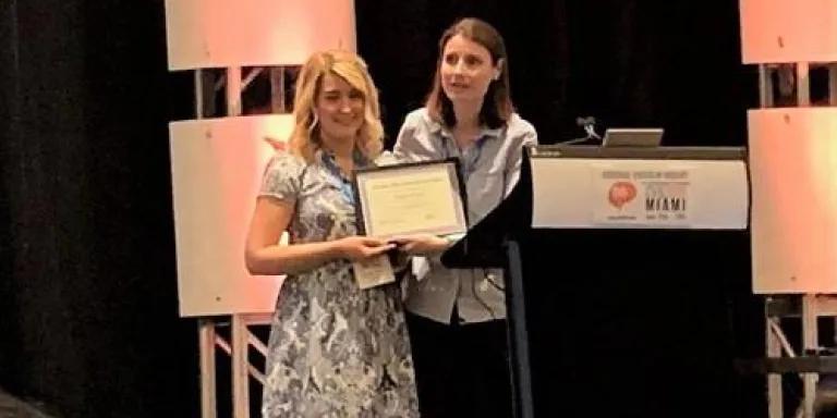 Sophie Quick receiving the award